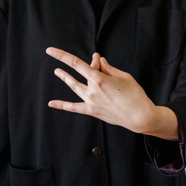 Close up of a person's hands in a mudra